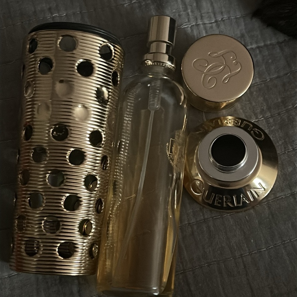 Vintage gold Guerlain refillable canister for Shalimar EDT.